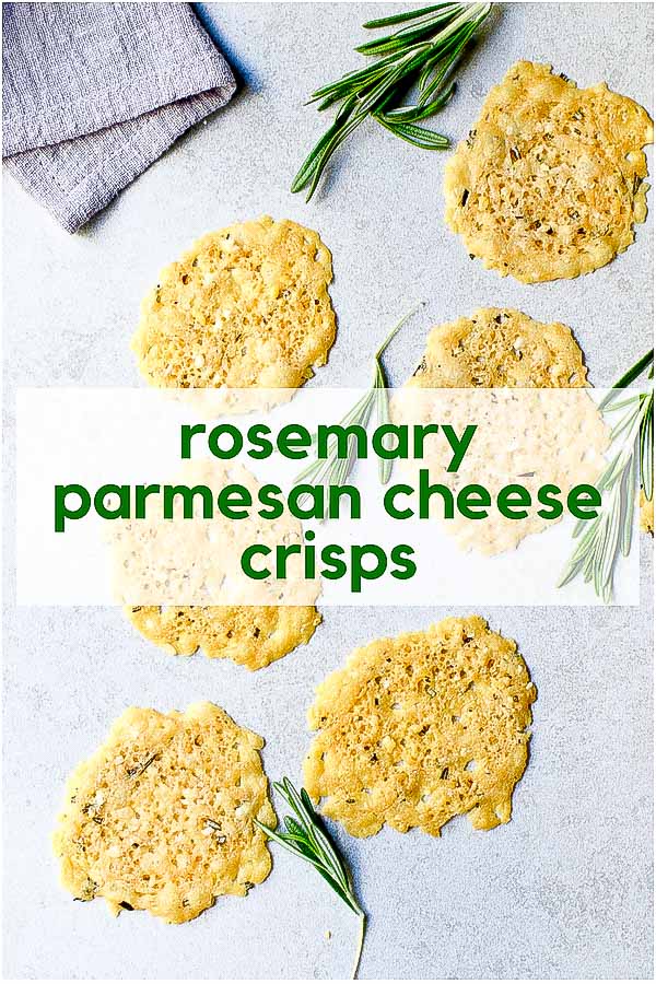 Rosemary Parmesan Cheese Crisps with fresh rosemary sprigs on gray background