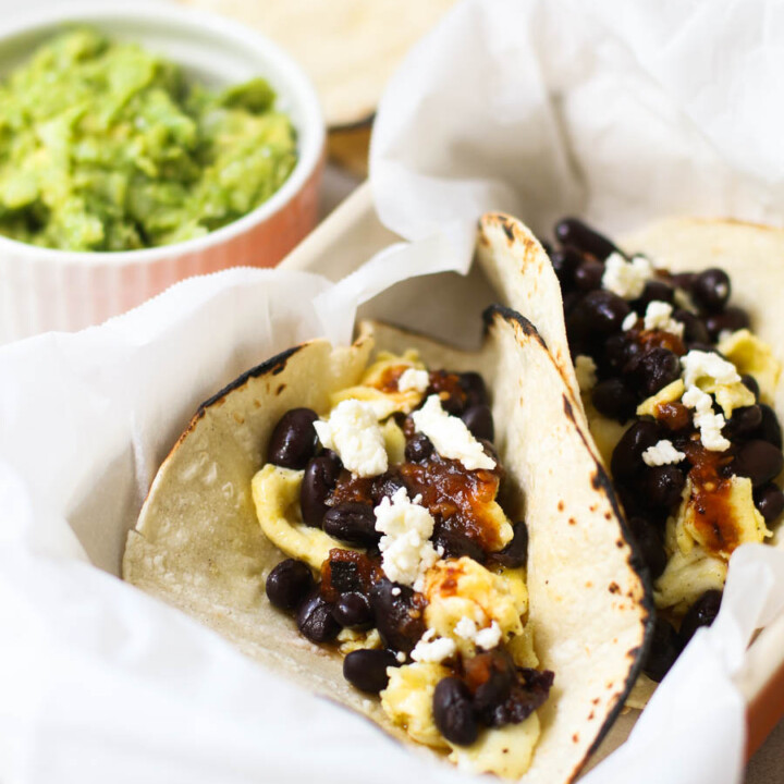Black Bean Breakfast Tacos with guacamole in the background