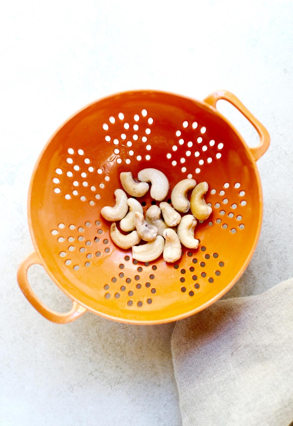 Soaked Cashews in a colander