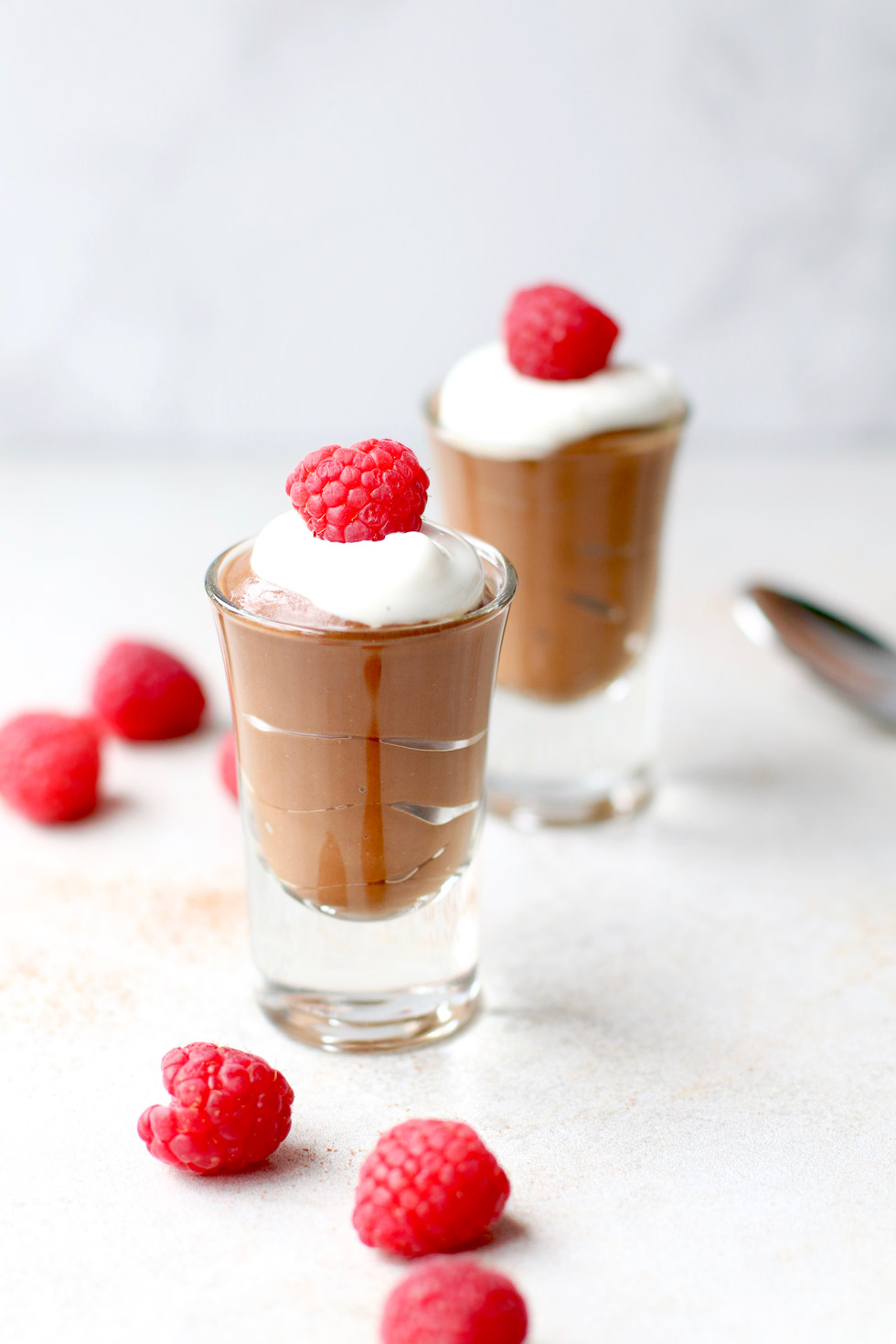 Avocado chocolate pudding in small clear glasses 