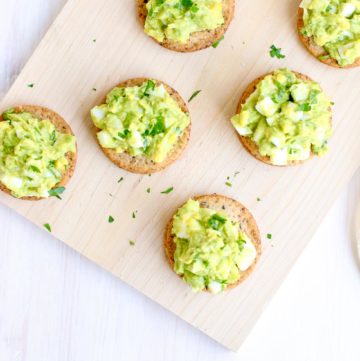 Egg Avocado Salad on Sprouted Seed Crackers overhead vertical