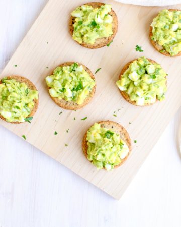 Egg Avocado Salad on Sprouted Seed Crackers overhead vertical