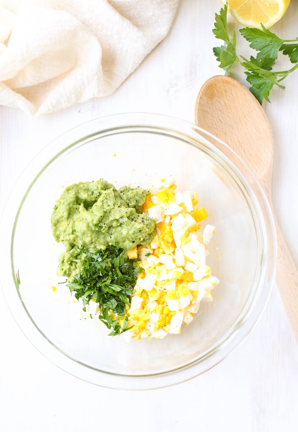 Egg avocado Salad Mixing Ingredients in a bowl