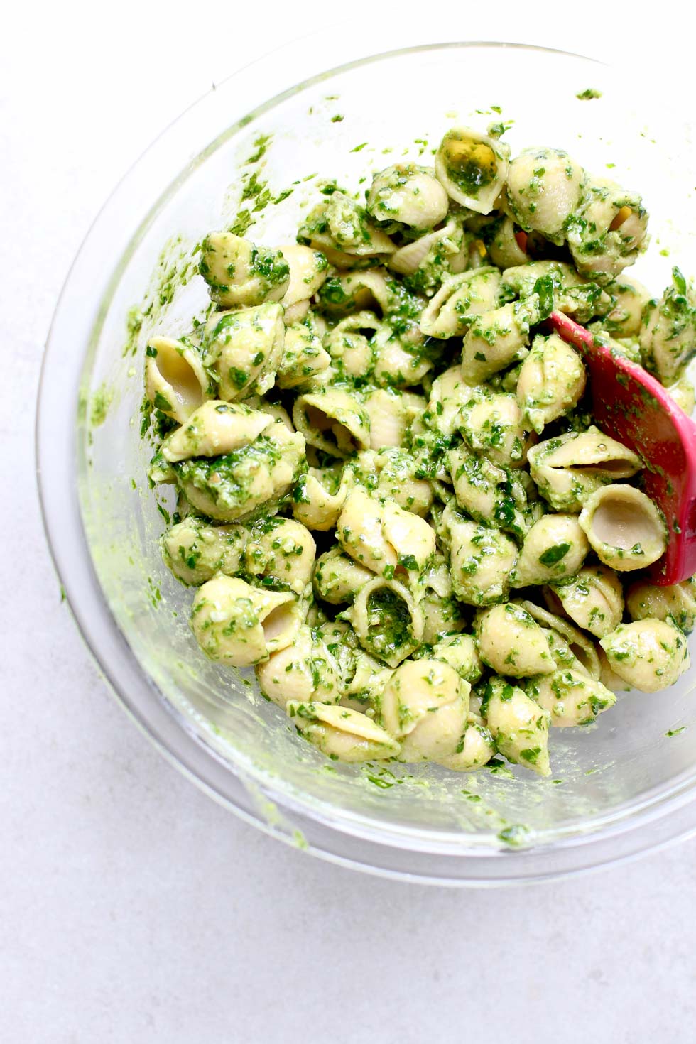 Mixing Chickpea Pasta with Walnut Pesto