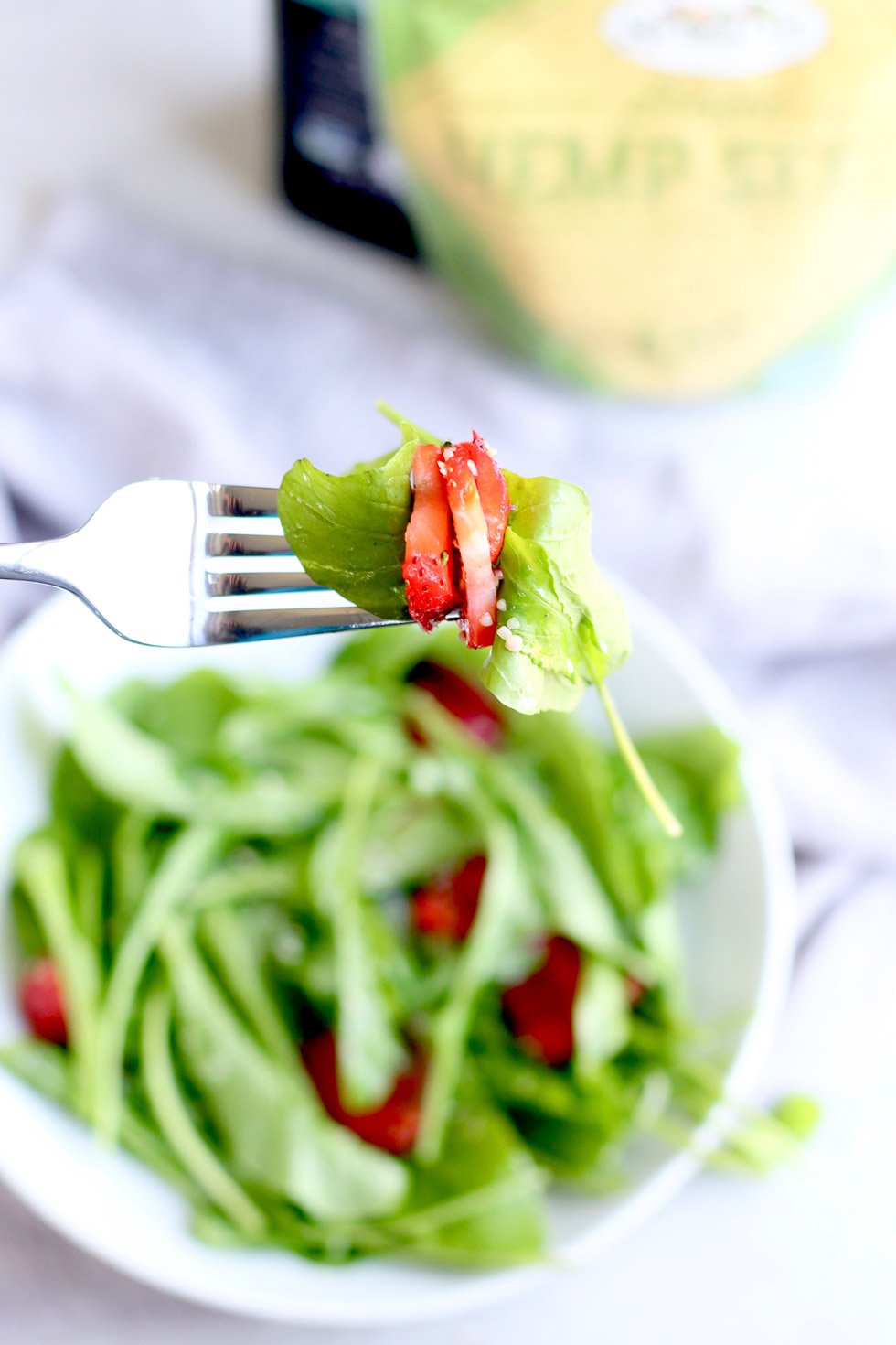 Strawberry Arugula Salad with Hemp Seeds on Fork