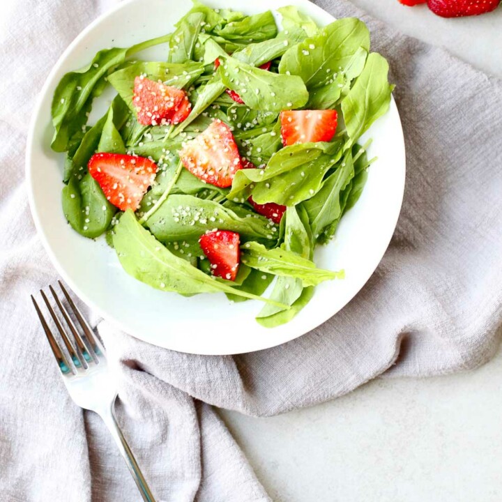 Strawberry Arugula Salad with Hemp Seed with fork