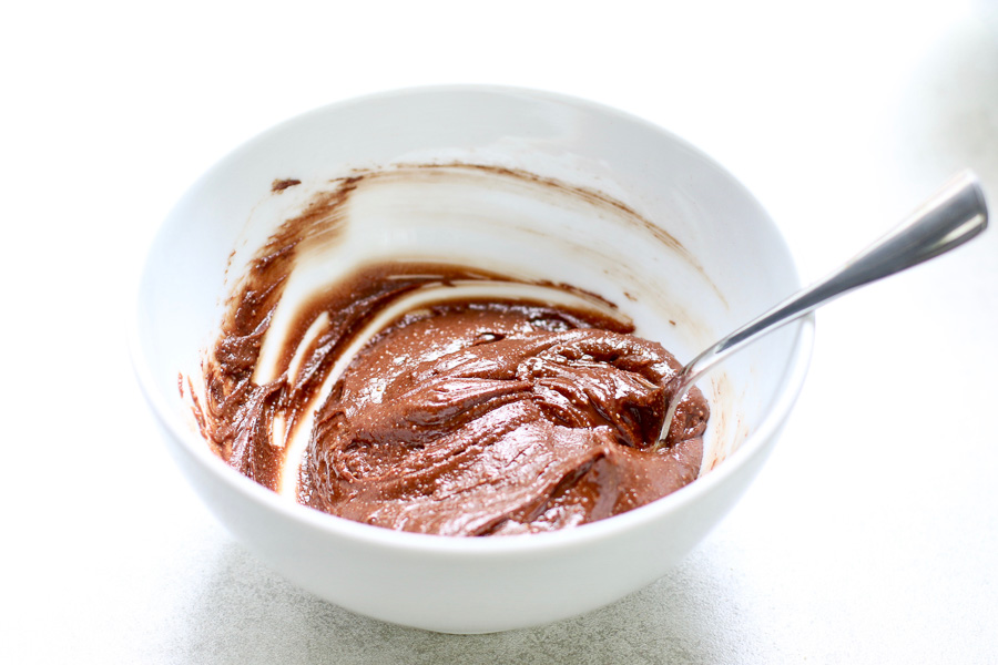 Chocolate filling mixed in bowl with spoon