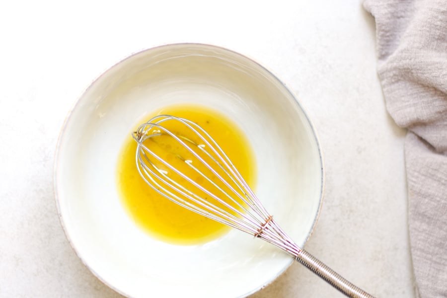 Whisking white wine vinaigrette