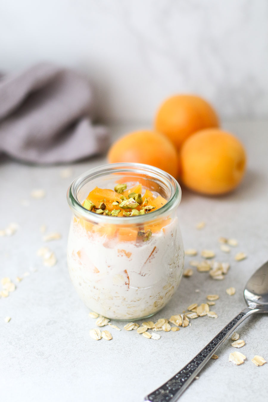 apricot overnight oats with milk in a jar
