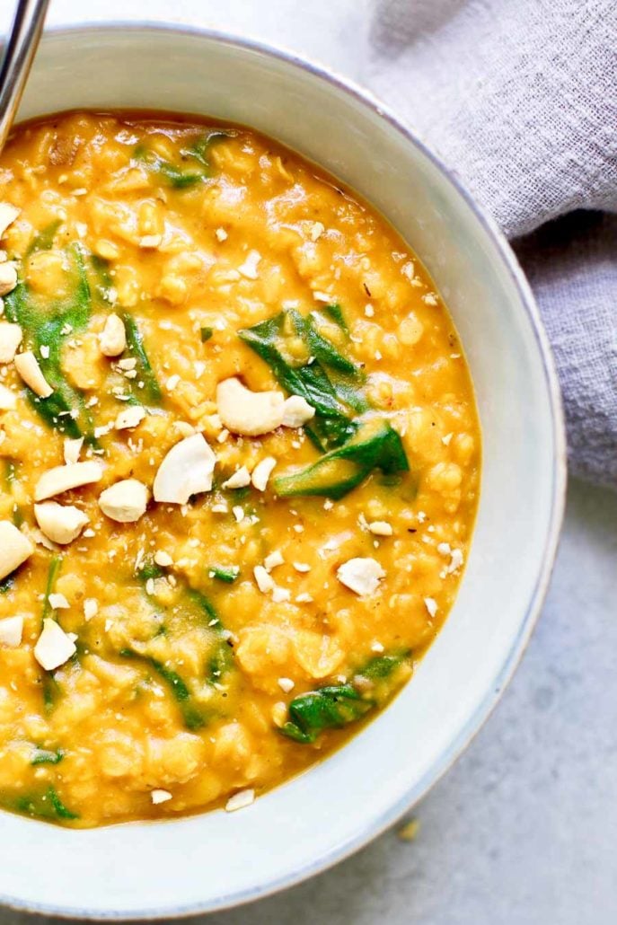 Pumpkin Lentil Curry in a bowl with cashews close up