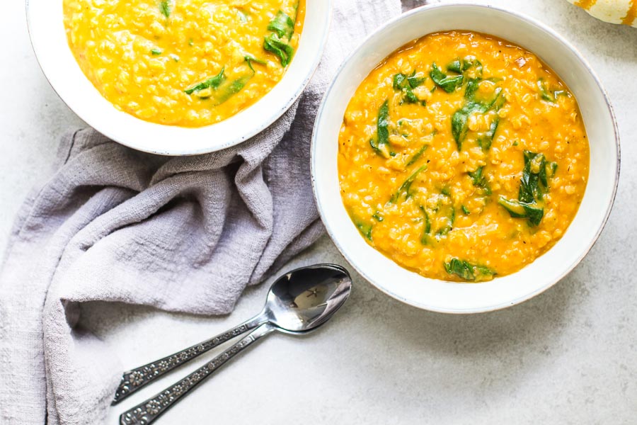 Pumpkin Lentil Curry in two bowls with napkin