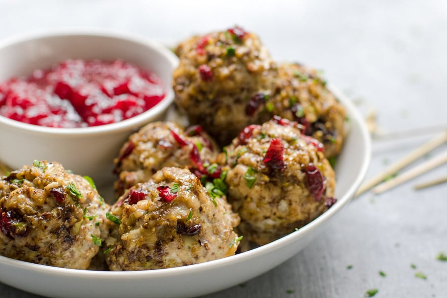 Turkey Mushroom Meatballs in a bowl with cranberry sauce