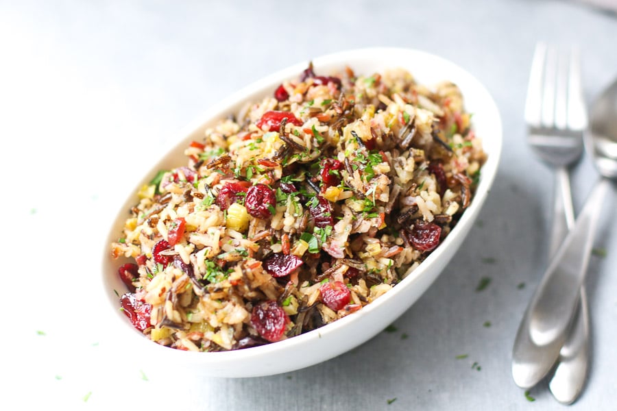 vegan wild rice stuffing in dish with utensils