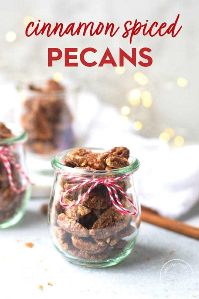 cinnamon spiced pecans in jars with lights