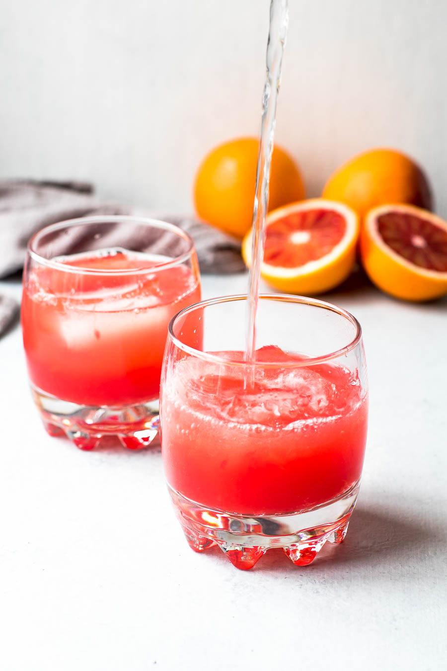 sparkling water pour into blood orange juice