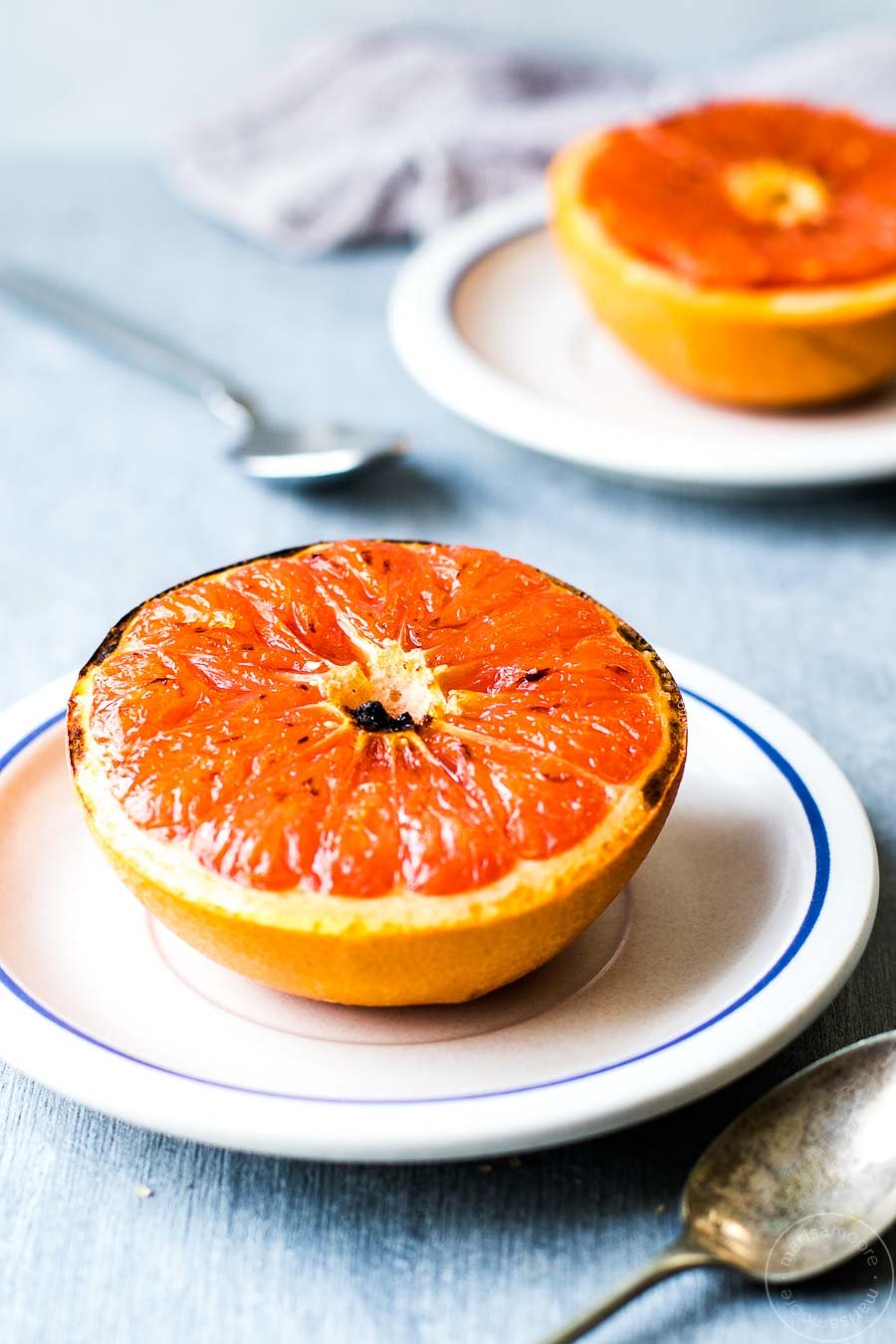 Broiled Grapefruit on two plates