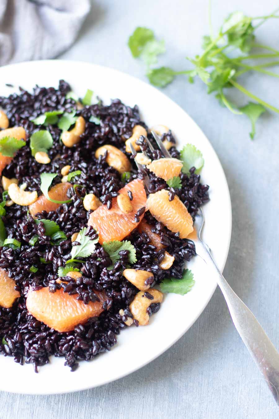 orange and black rice salad on a plate