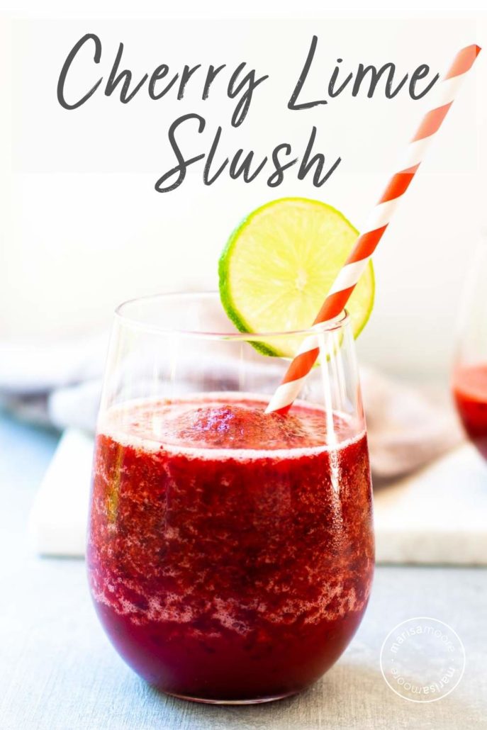 Cherry Lime Slush in a glass with a straw