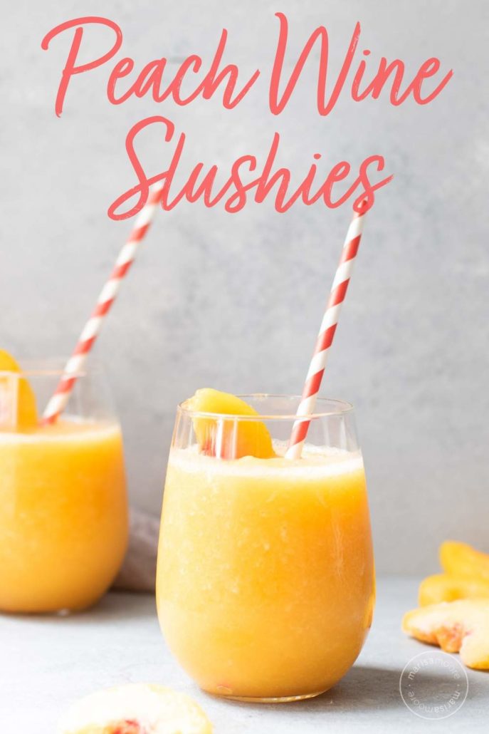 Peach slush in two glasses with red and white straws