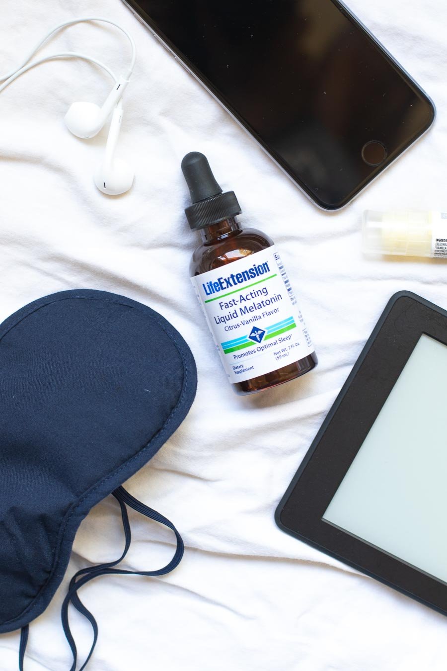 Bottle-of-Life-Extension-Melatonin-with-sleep-mask-and-ear-buds