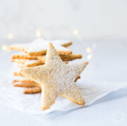 Almond Flour Cookies stacked with lights in the background
