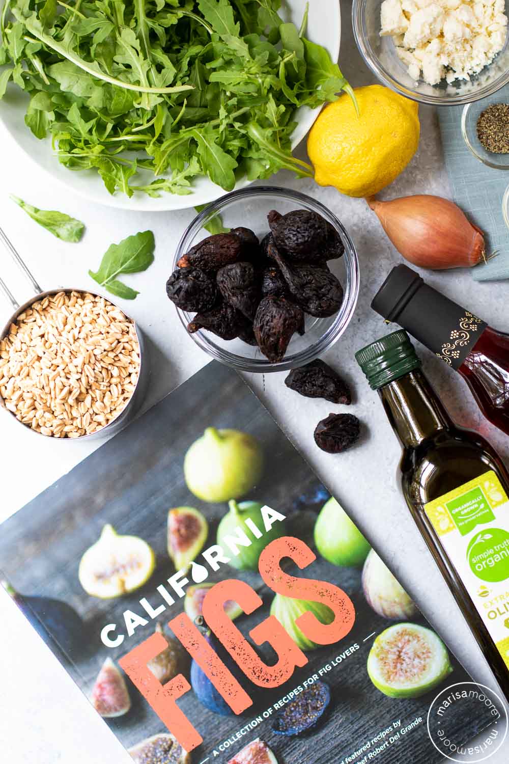 Ingredients for fig farro salad with a California Fig Cookbook