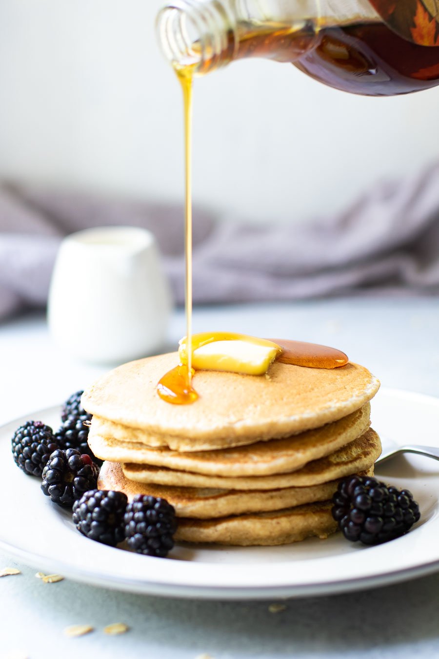 Oat Flour Pancakes with Syrup pouring