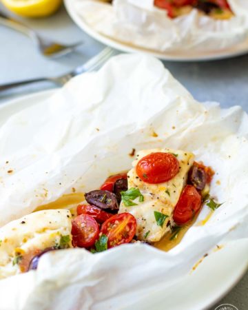 Mediterranean Cod in Parchment with lemon on a plate