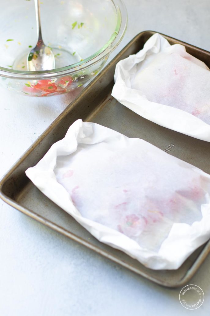 packets closed on a sheet pan with empty bowl