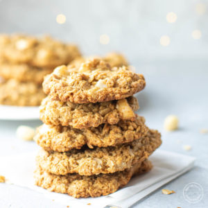 stacked oatmeal cookies with lights in the background