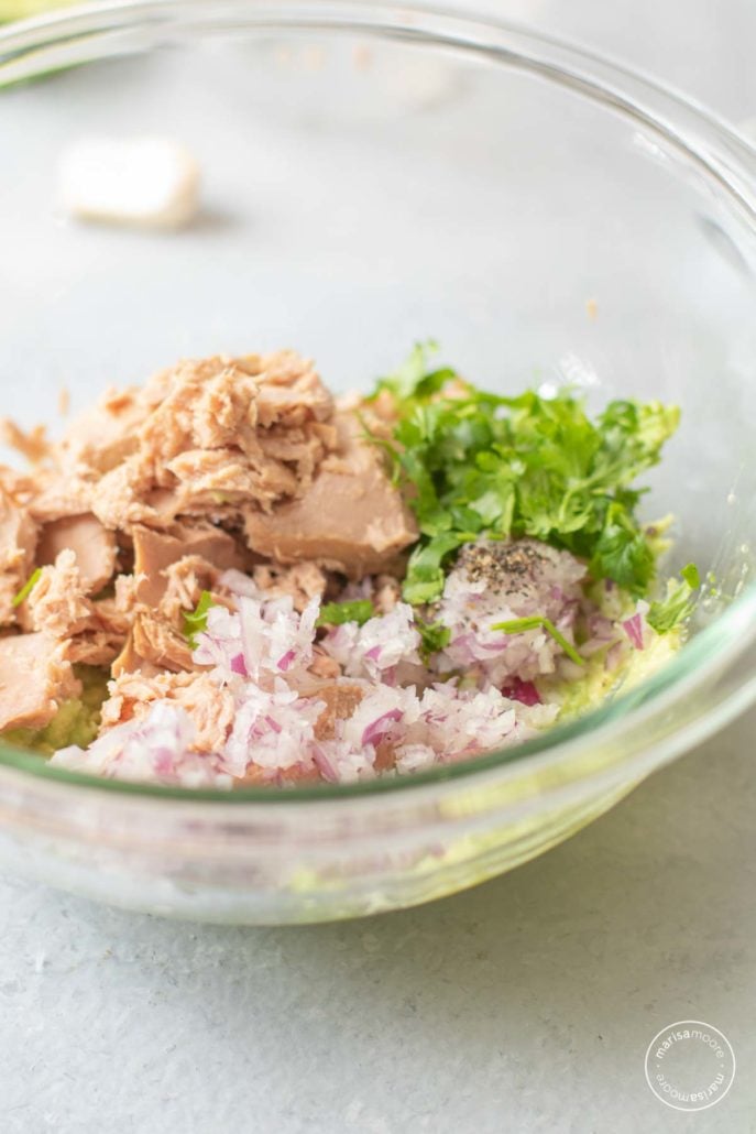 Tuna, cilantro, avocado, onion, in a clear bowl