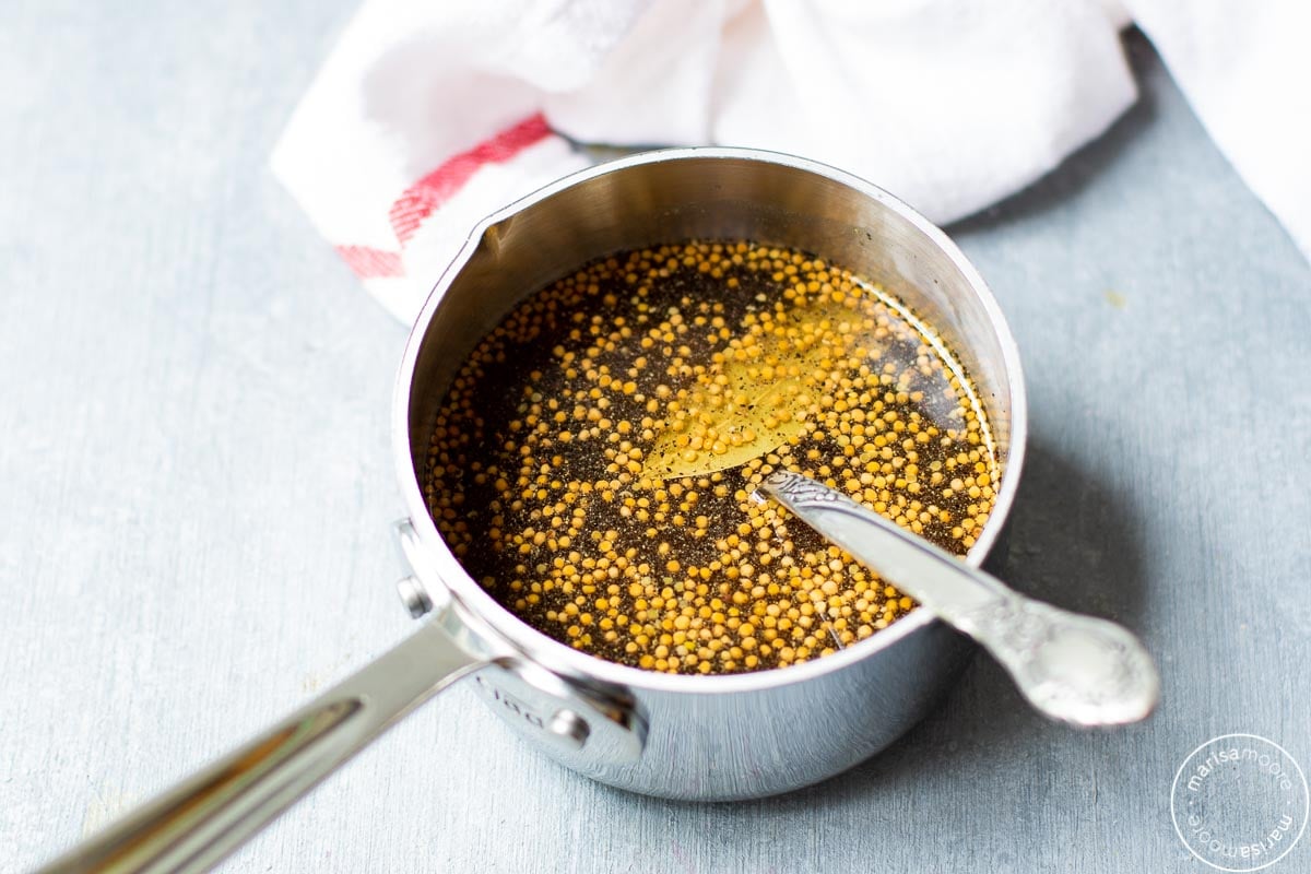 Pickling liquid in a small saucepan with a spoon 