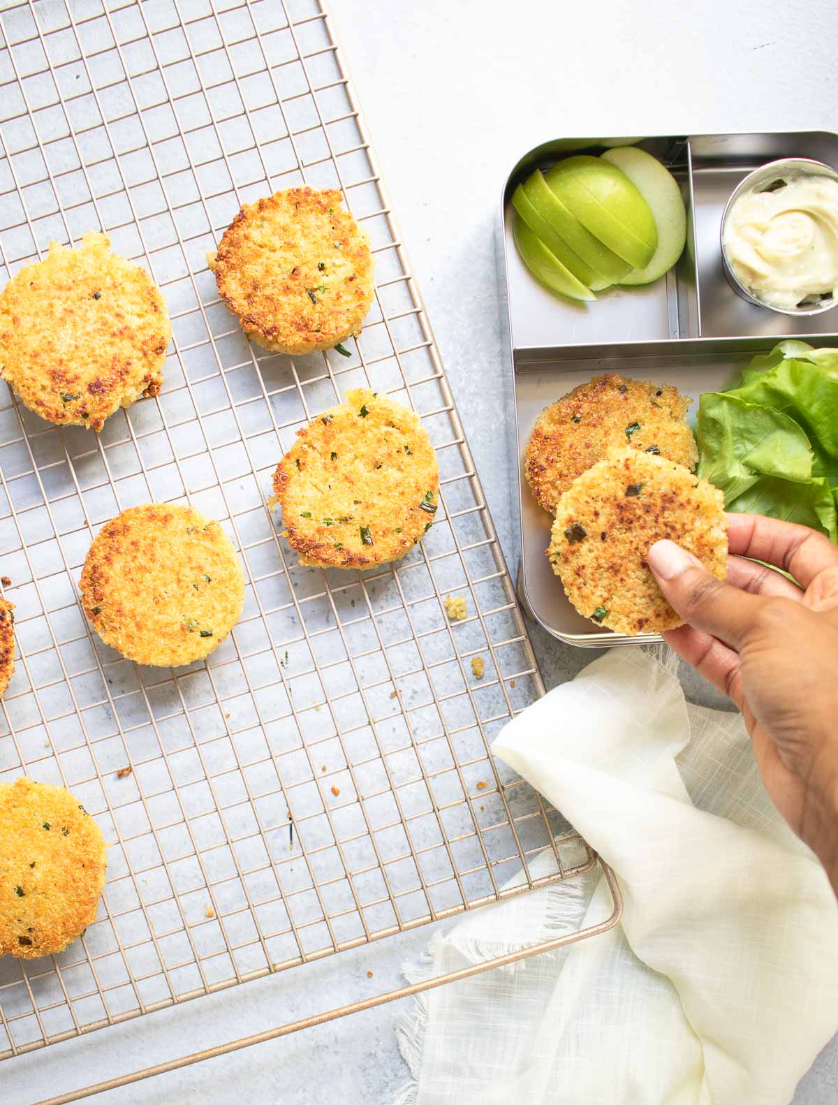 Taking patties from the cooling rack to a bento box