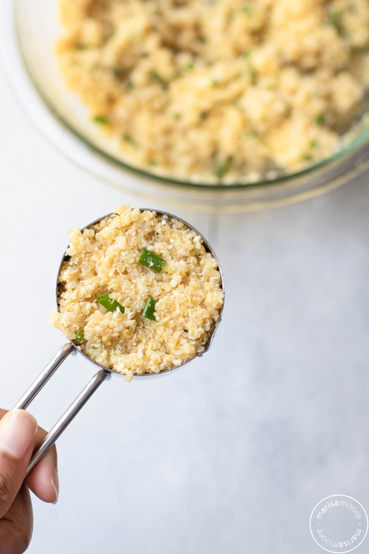 ⅓ cup measuring cup filled with the quinoa patty mixture 