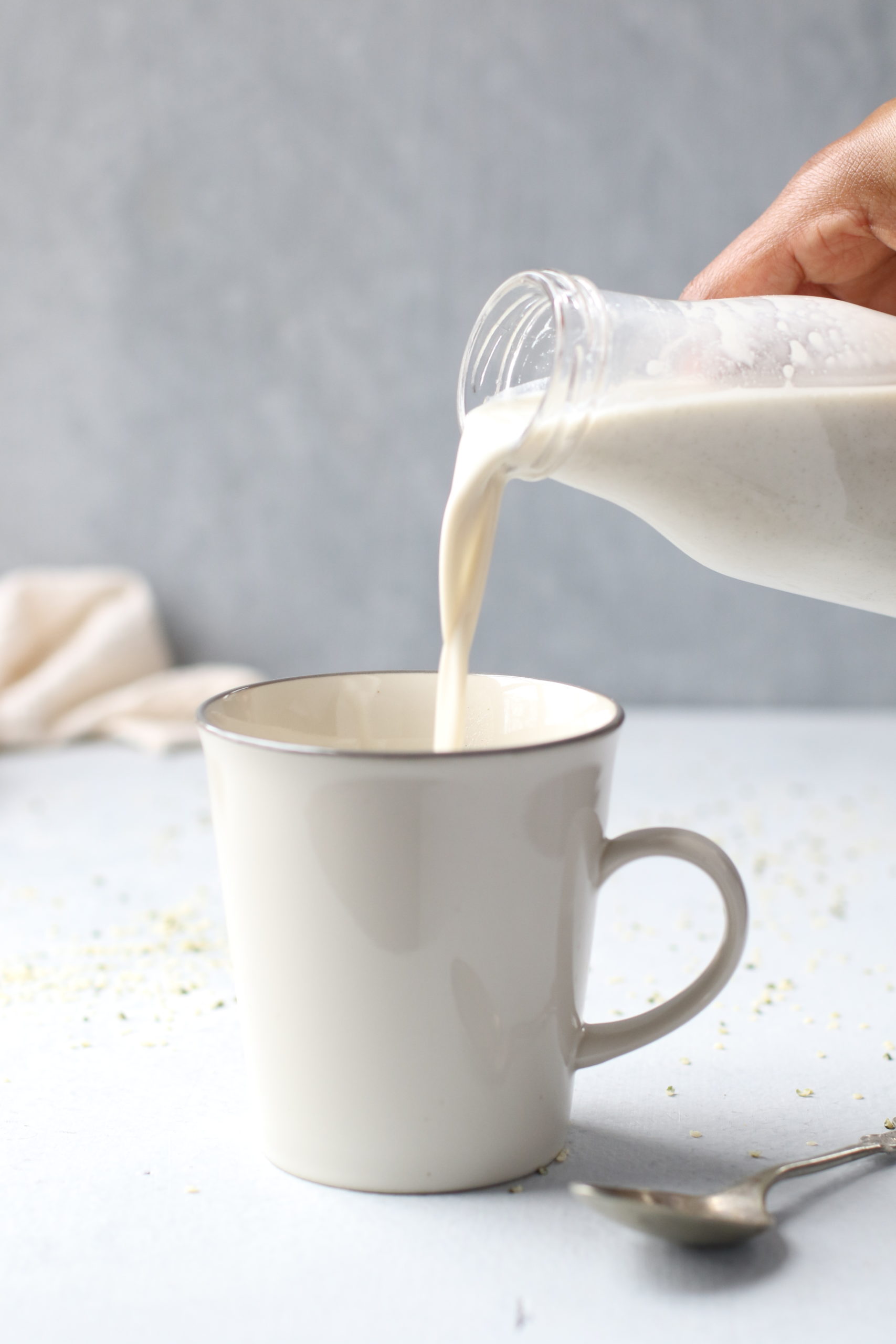 Pouring Hemp Milk into coffee cup