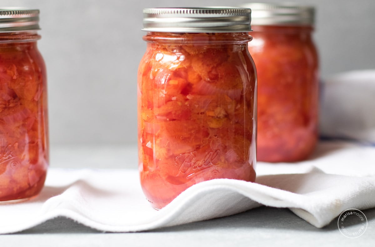 Jars of salsa on a white towel