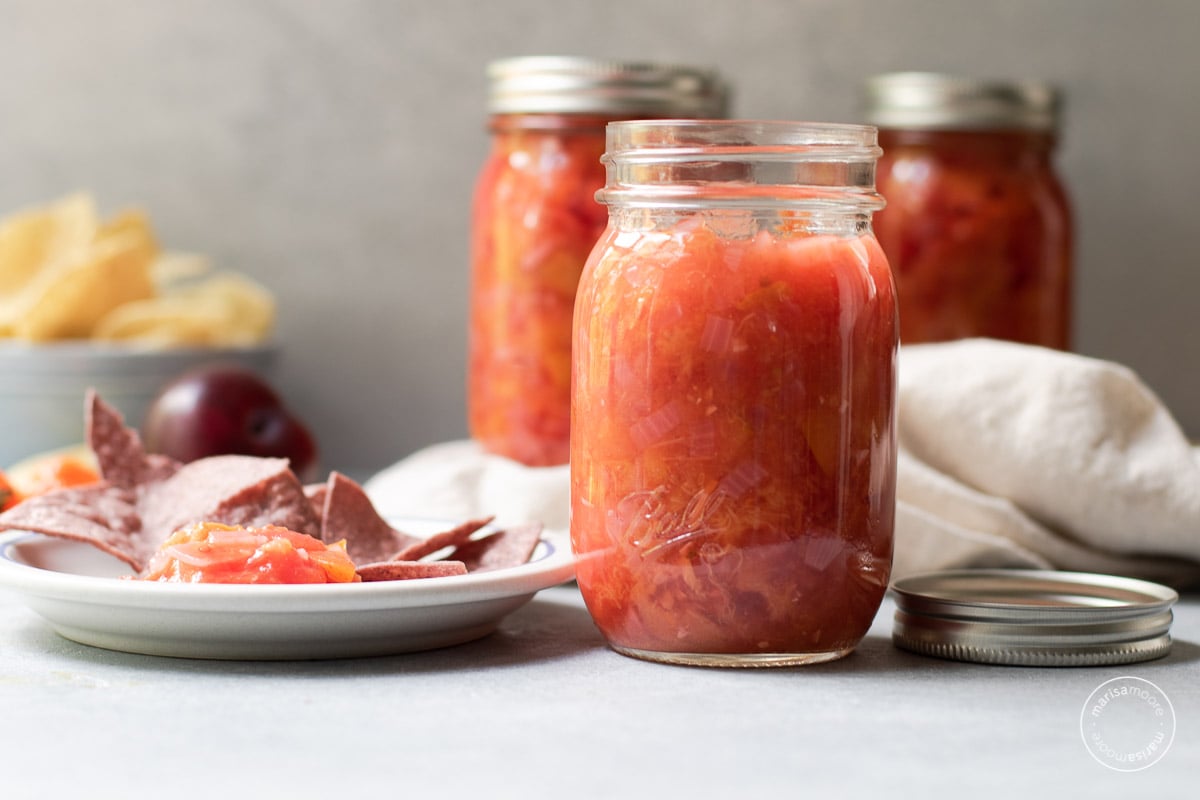 open salsa jar with tortilla