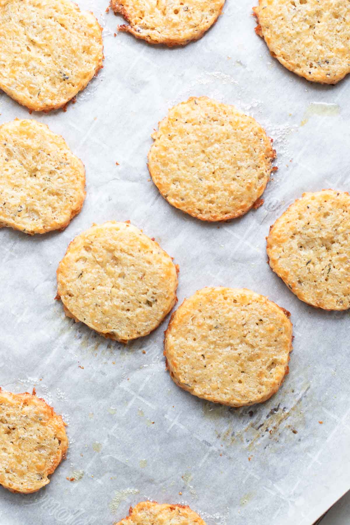 Baked cheese cookies on parchment