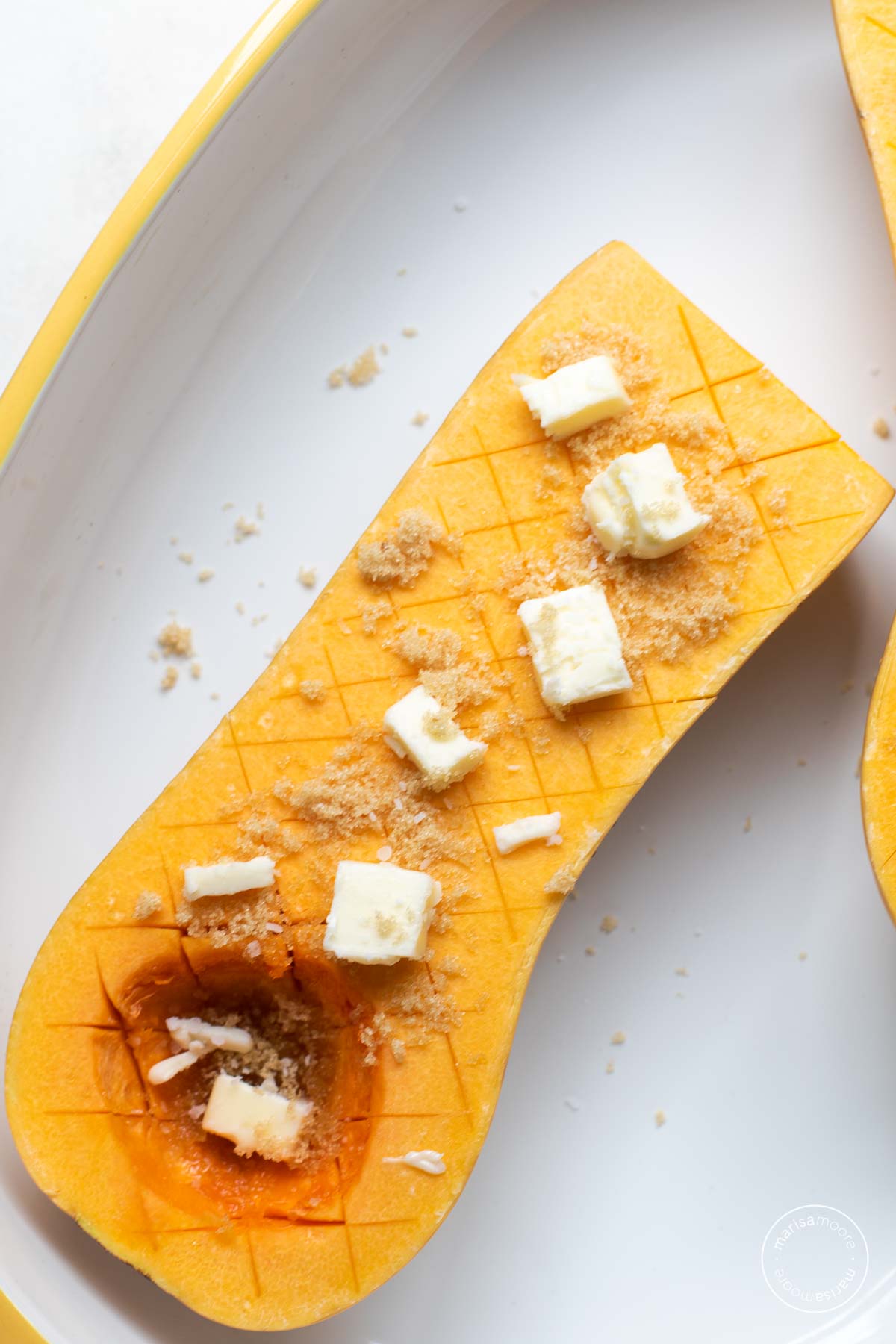 Squash half with butter, sugar and spice sprinkled.