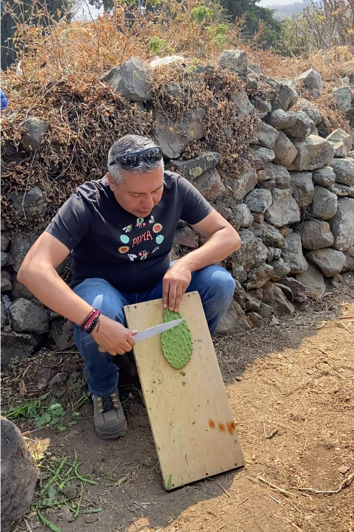 chef Jorge Córcega removing thorns from nopal.